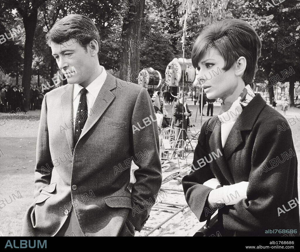 Audrey Hepburn and Peter O'Toole. The British actors Audrey Hepburn and Peter O'Toole standing on the set of the movie 'How To Steal a Million' by William Wyler. 1965.