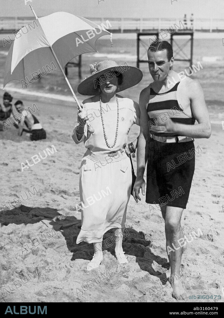 Palm Beach, Florida: 1922 Mr. and Mrs. Claude Graham White, on the beach outside their cottage in Palm Beach. He is the famous British aviator, and she is notable in her own right as the vaudeville star, 'Ethel Levey'. She was fomerly the Mrs. George M Cohan, the man who 'once owned Broadway', and was the father of American musical comedy.