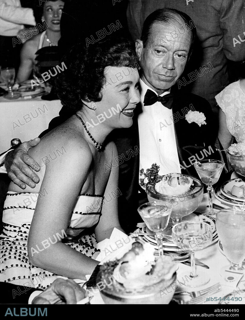 Cole Porter, composer of more than 300 songs, who died on Friday, was one of the most debonair playboys in the Western World. Cole Porter dines with actress Jane Wyman in New York. In the roaring twenties he kept a villa in Bavaria, a palazzo in Venice, a flat in London, a house in Paris and threw the most fabulous parties in Europe. In Venice he once hired an entire ballet company to dance again a background ***** are just as elegant and precise and the food beautifully served, and Cole always wears his usual boutonniere, a white carnation. "No matter what happens this sense of beauty is something that Cole Porter will never lose". October 20, 1953.