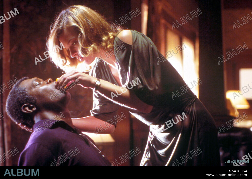MILLA JOVOVICH and SAMUEL L. JACKSON in NO GOOD DEED, 2002, directed by BOB RAFELSON. Copyright SEVEN ARTS PROD/KISMET ENT/REMSTAR CORPORATION/APOLLOMEDIA.