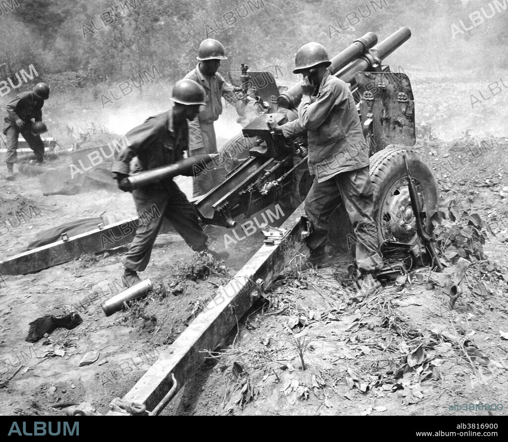 Caption: "U.S. Army artillery crew fires a 105-millimeter howitzer against North Korean Communist positions during a battle in the Republic of Korea." On June 25, 1950, the Korean War began when soldiers from the North Korean People's Army crossed the 38th parallel, the boundary between the Soviet-backed Democratic People's Republic of Korea to the north and the pro-Western Republic of Korea to the south. This invasion was the first military action of the Cold War. By July, American troops had entered the war on South Korea's behalf. After some early back-and-forth across the 38th parallel, the fighting stalled and casualties mounted with nothing to show for them. Meanwhile, American officials worked to fashion some sort of armistice with the North Koreans. The alternative, they feared, would be a wider war with Russia and China. In July 1953, the Korean War came to an end. 5 million soldiers and civilians lost their lives during the war. The Korean peninsula is still divided today.