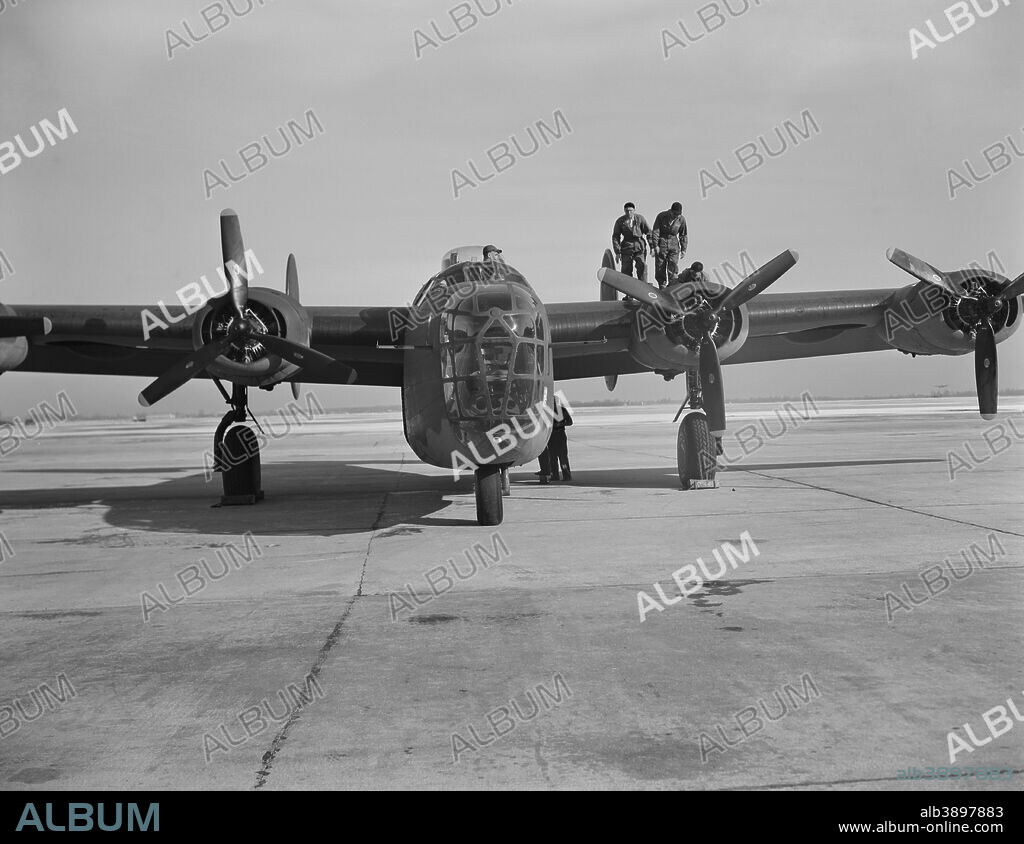 A B-24E Liberator bomber gets a last minute inspection before taking off on its test flight at Willow Run, Michigan. The Liberator is capable of operation at high altitudes and over great ranges on precision bombing missions. circa 1942-1943.