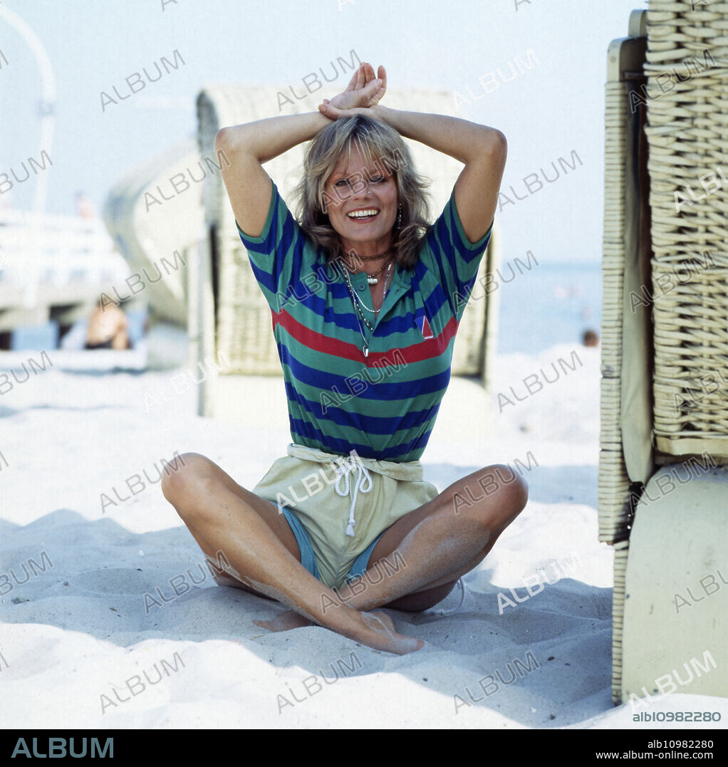 The German actress Christiane Rücker in different poses on the beach, 1970s.