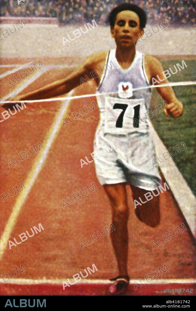 Boughera El Ouafi winning the marathon for France, 1928. Algerian athlete El Ouafi (1898-1959) competed during the time Algeria was part of France. He won the Olympic gold medal in the marathon at the 1928 Summer Olympics, held in Amsterdam. From "Die Welt in Bildern", (The World in Pictures), cigarette card album, c1928. [Georg A Jasmatzi, A.-G., Dresden, Germany].