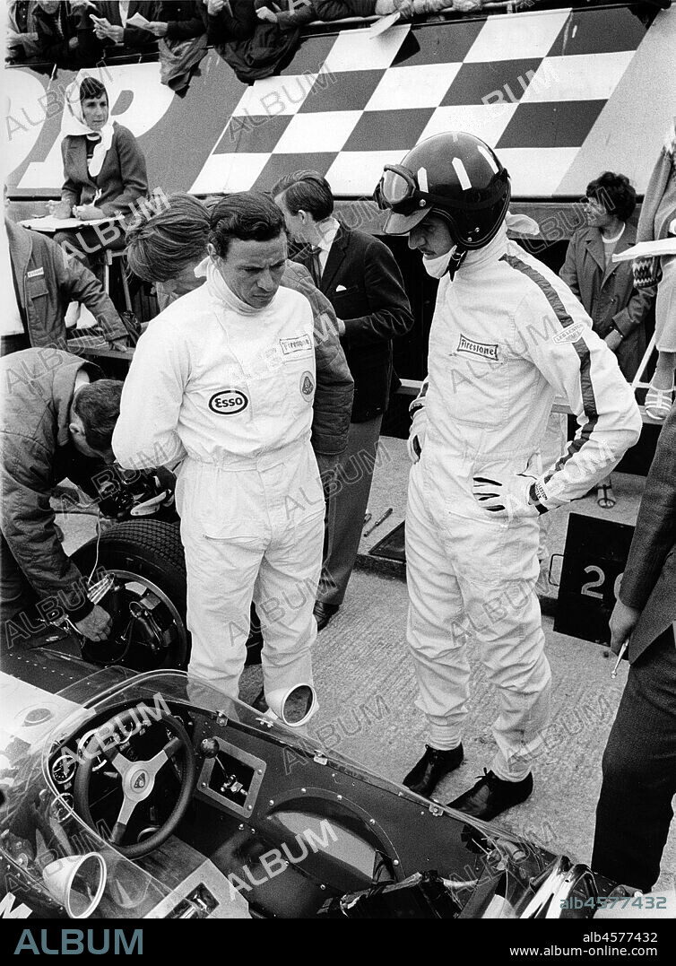 Jim Clark and Graham Hill in pits with Lotus 49 during 1967 British Grand Prix.