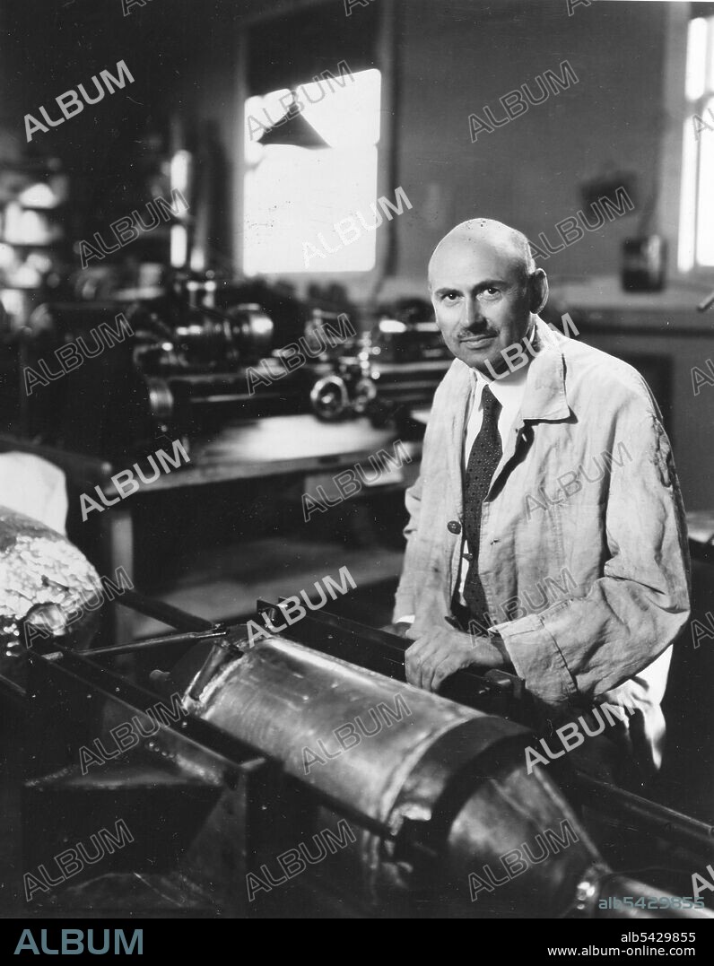Dr. Robert Goddard works on a rocket at his shop in Roswell, New Mexico. Dr. Goddard is recognized as the 'Father of American Rocketry.' October 1935.