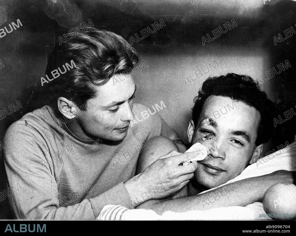 Aus., Melbourne, Olympics, 1956: Ervin Zador (Hungary) gets some medical attention from a team mate, Miklos Martin, after a water polo match against USSR.