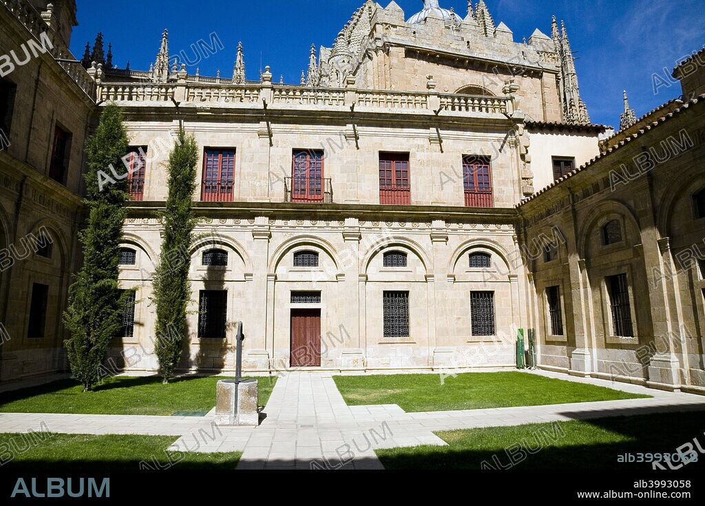 The courtyard of the Old Cathedral, Salamanca, Spain, 2007. This Romanesque cathedral was founded in the 12th century. The dome that covers its crossing springs from a double arcade that is daringly pierced with windows, a distant reflection of Hagia Sophia. The mass of four pinnacles at the outside corners counter the thrust of the dome's weight. The thrust of the vaulting is borne by four massive pinnacles. The vault of the apse was frescoed by the Early Renaissance painter Nicolas Florentino.