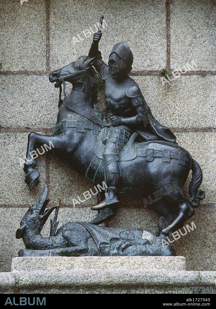 Saint George slaying the Dragon. Bronze statue by Jose Rodriguez, 1963. St. George square. Caceres. Extremadura, Spain.