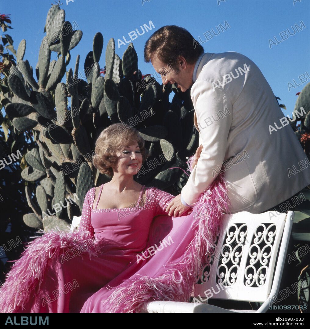 German opera singer Anneliese Rothenberger shooting a song with Austrian tenor Peter Minich, 1970s.