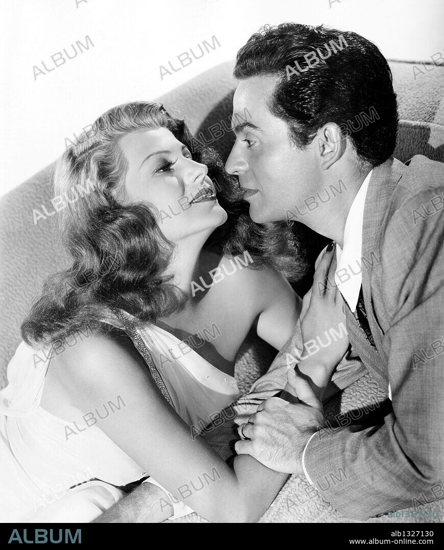 LARRY PARKS and RITA HAYWORTH in DOWN TO EARTH, 1947, directed by ALEXANDER HALL. Copyright COLUMBIA PICTURES.
