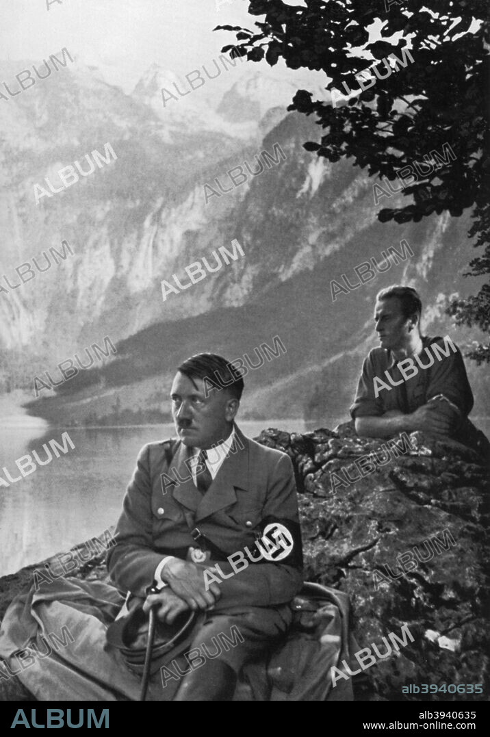 The Führer at the Upper Lake, Berchtesgaden, Bavarian Alps, Germany, 1936. German Nazi leader Adolf Hitler (1889-1945) during one of his frequent stays at his mountain retreat, the Berghof at Obersalzberg. A print from Adolf Hitler. Bilder aus dem Leben des Führers, Hamburg: Cigaretten/Bilderdienst Hamburg/Bahrenfeld, 1936.