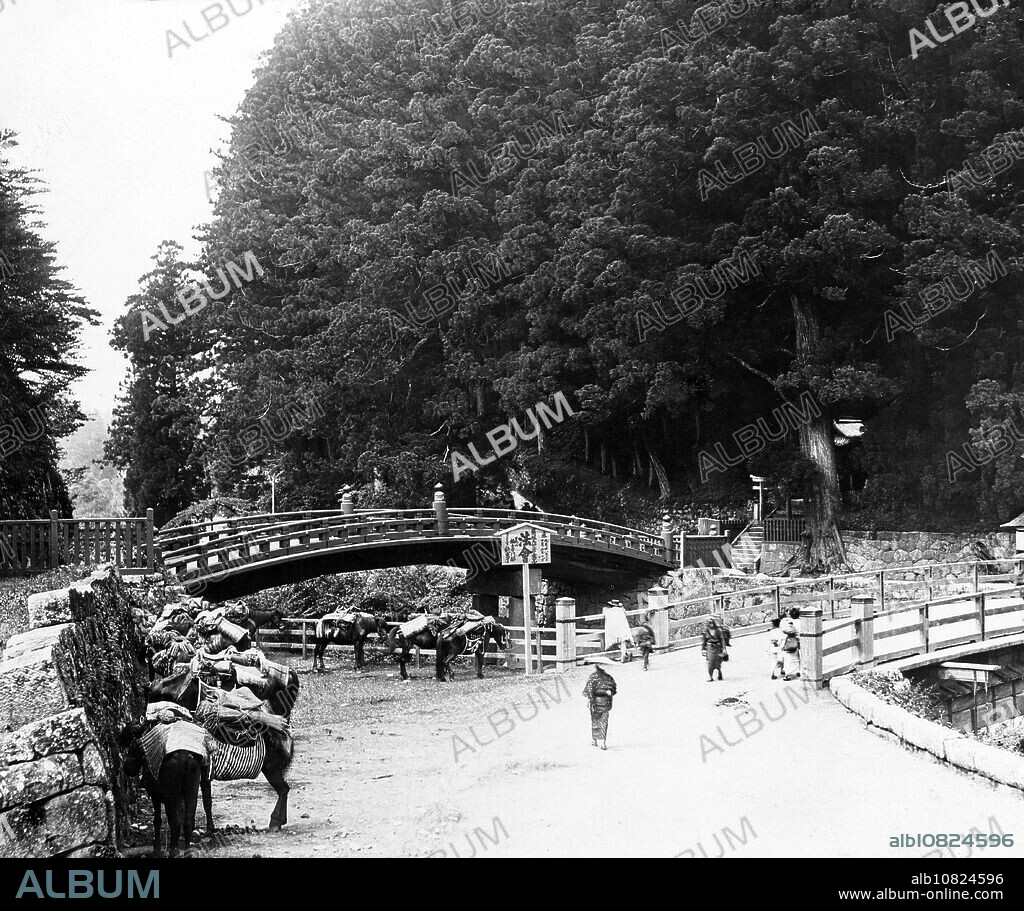 [ 1890s Japan - Sacred bridge, Nikko ] The sacred Kamibashi Bridge across the Otanigawa River in Nikko. From a series of glass slides published (but not photographed) by Scottish photographer George Washington Wilson (18231893). Wilsons firm was one of the largest publishers of photographic prints in the world. 19th century vintage glass slide.