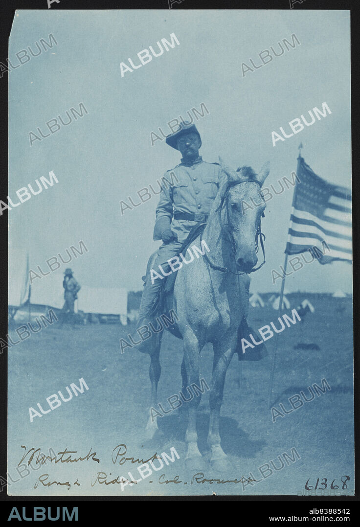 FRANCES BENJAMIN JOHNSTON. Montauk Point, Rough Riders, Col. Roosevelt, 1898. Photograph shows Theodore Roosevelt wearing Rough Rider uniform, seated on horse, facing front, with American flag on the right.