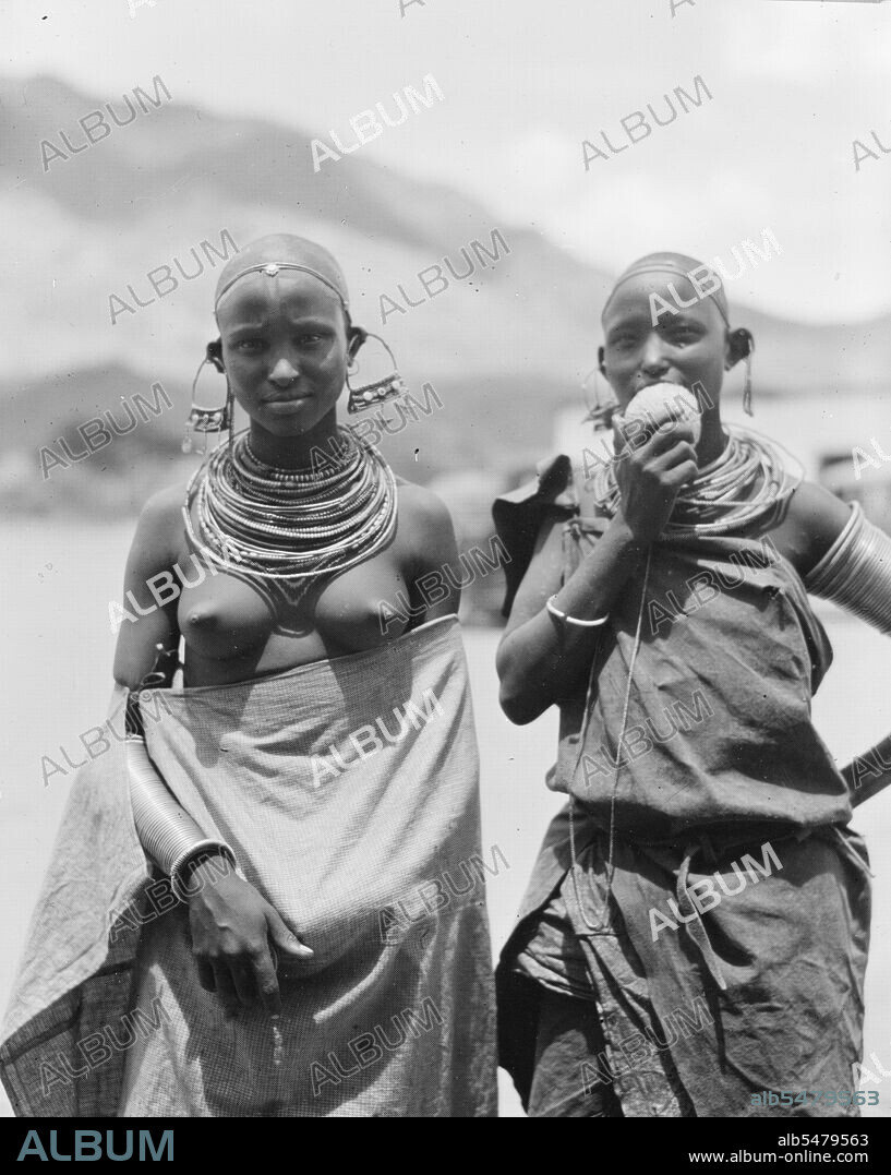 Traditional semi-nude Longido girls with large ear ornaments in Tanzania ca. 1936.