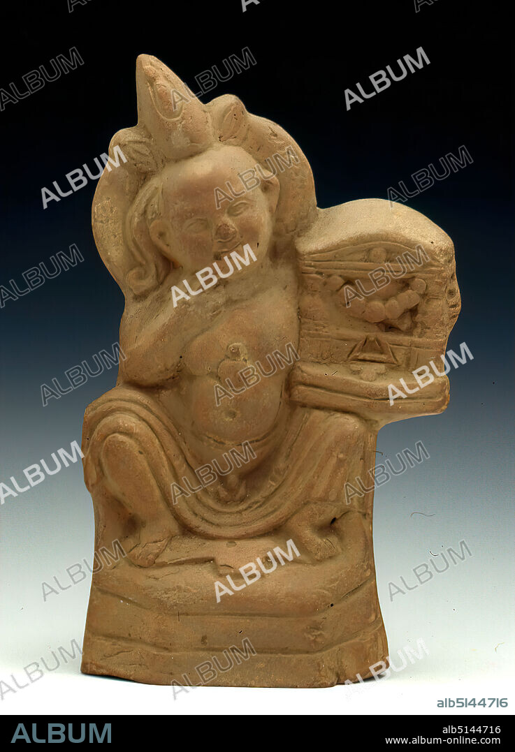 Harpocrates with temple shrine, clay, pressed into the form, hand-modeled, fired (ceramic), clay, Total: Height: 14.4 cm; Width: 9.4 cm; Depth: 5 cm, Pottery, Egyptian gods, demigods, heroes, Harpocrates, seated figure, Early Imperial period, Middle Imperial period, Late Imperial period, The childlike, corpulent harpocrates with youth curl is enthroned on a profiled hexagonal base with a blanket With his left hand he holds a small temple shrine placed on his knee. He has led his right index finger to his mouth in a gesture typical of the god. He is naked except for a cloth laid over his thighs, which leaves his thick belly and penis free. On his chest lies a so-called heart amulet. The skull is decorated with a wreath and the double crown flanked by two buds. Harpocrates, Horus as a child, is the most favored figure among the Greco-Roman terracottas besides the goddess Isis. The depictions have undergone a thorough Hellenization, whereby native Egyptian features are always connected with Greek ones. The shaven head with horus curl is Egyptian. The temple shrine is - as the comparisons show - quite rare. The figure belongs to the group of the so-called Fayum terracottas. In Alexandria, the international, Greek-influenced center of Egypt, lived a multicultural society of Egyptians, Orientals, Greeks, Romans, Jews and others, whose different religious ideas gradually merged. Insights into this world of faith are provided by the so-called Fayum terracottas. They are part of the religious household, children's toys, knick-knacks, but also cult symbols, grave goods, pilgrimage images, votive offerings and magical objects for banishing evil forces. They can be found in houses, graves and sanctuaries.