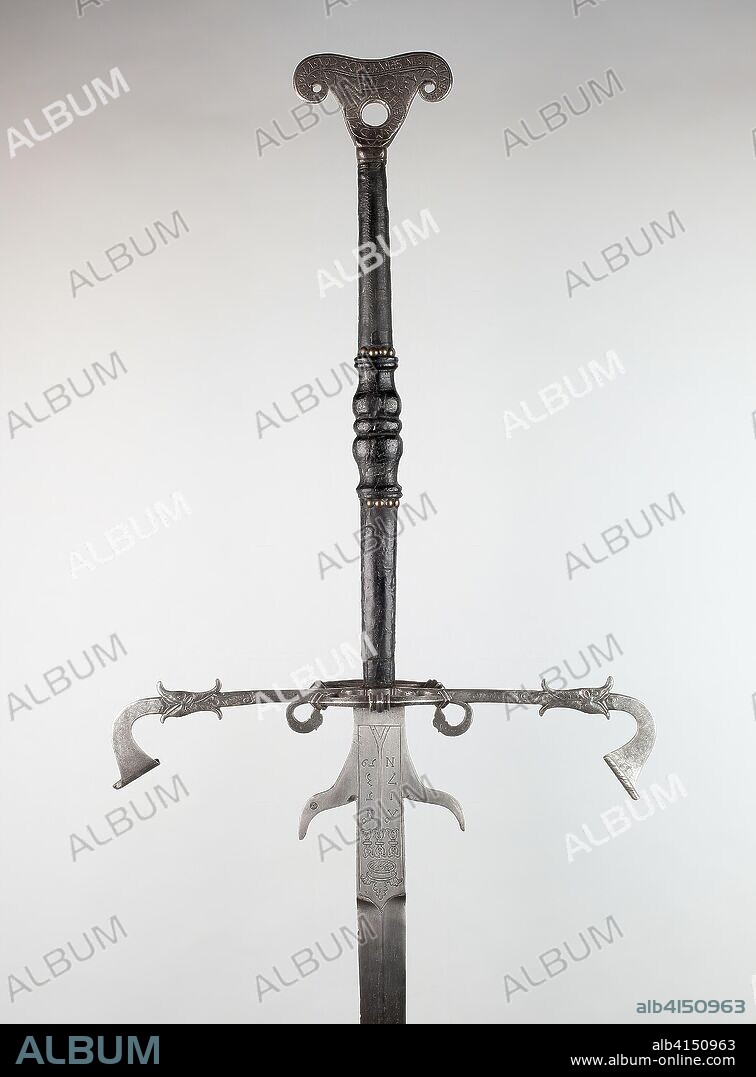 Two-Handed Sword for the Bodyguard of Julius, Duke of Brunswick-Lüneburg and Prince of Wolfenbüttel. Northern German, Brunswick. Date: 1560-1580. Dimensions: Overall L. 198.1 cm (6 ft. 6 in.) 
Wt. 10 lb. 1 oz. Iron, steel, brass, wood, and leather. Origin: Northern Germany.