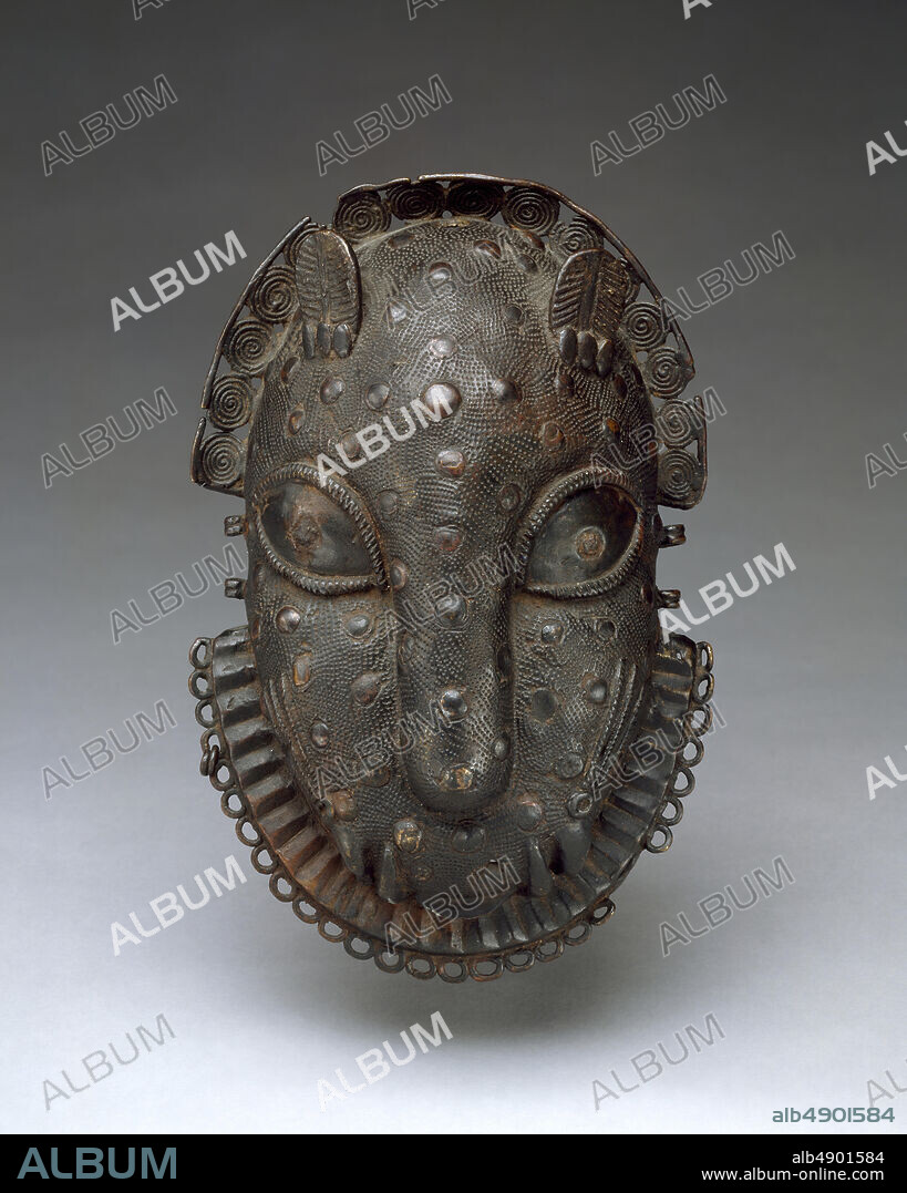 Hip Ornament: Leopard Head, Edo peoples, 16th19th century, Nigeria, Court of Benin, Edo peoples, Brass, iron, H. 7 1/2 x W. 4 3/4 x D. 2 1/8 in. (19.1 x 12.1 x 5.4 cm), Metal-Ornaments.