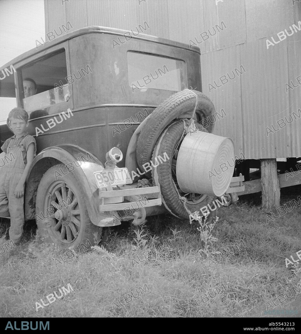 DOROTHEA LANGE. Migrant family's car near Brownsville, Texas.