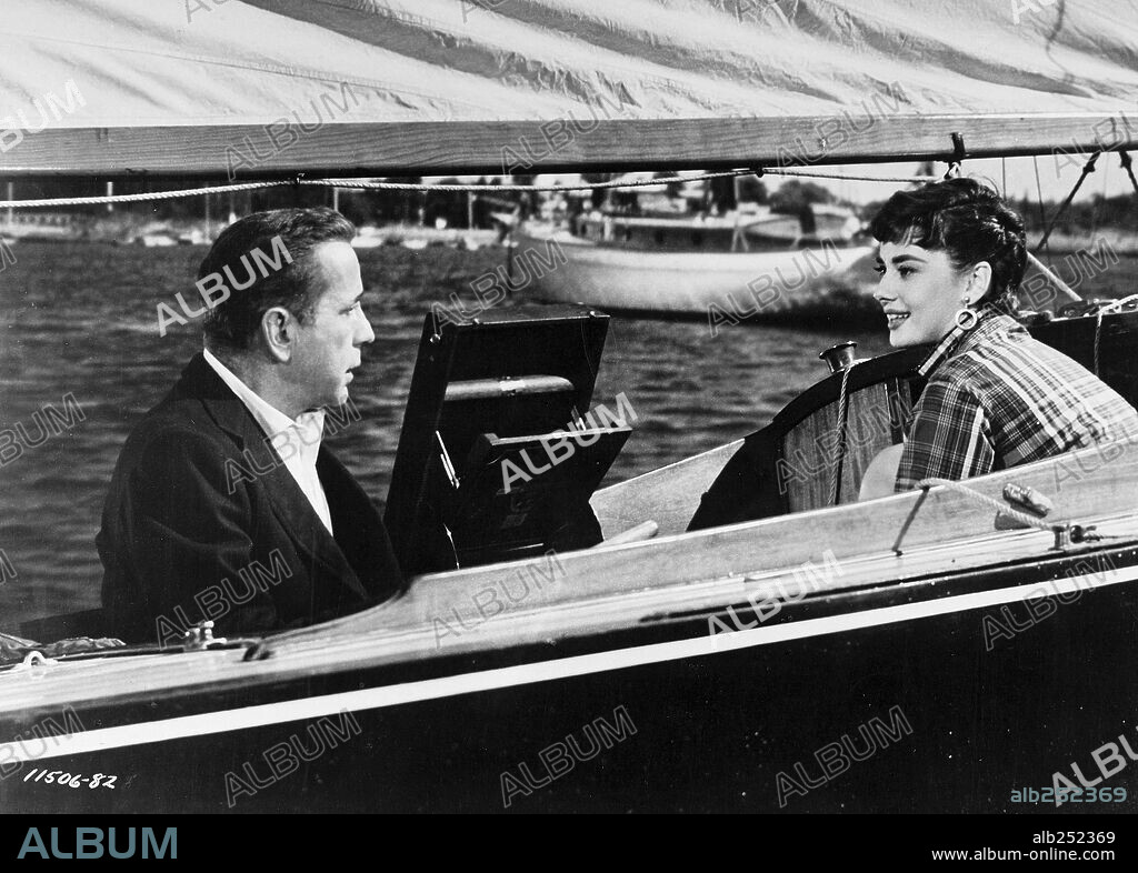 AUDREY HEPBURN y HUMPHREY BOGART en SABRINA, 1954, dirigida por BILLY WILDER. Copyright PARAMOUNT PICTURES.
