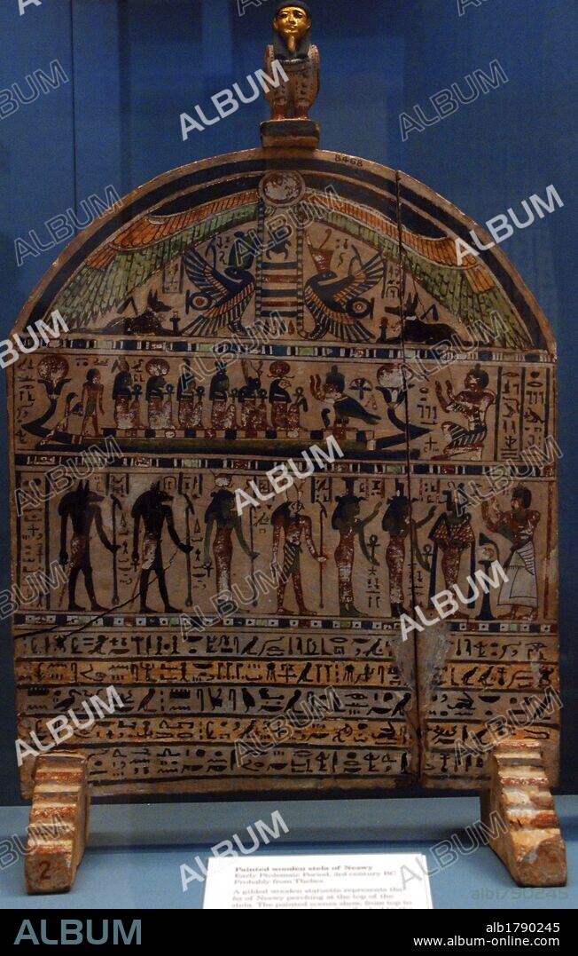 Painted wooden stela of Neswy with his Ba at the top. The scenes shown arranged in horizontal bands, from top to bottom, the winged solar disk flanked by the goddesses Nekhbet and Wadket as snakes and Anubis as a jackal; the deceased worshiping the Sun God and other deities in the solar boat; the deceased before Osiris, Isis, Nephthys, Horus, Hathor, Anubis and Wenawet. Early Ptolemaic Period. 3rd century BC. Probably from Thebes. British Museum. London. United Kingdom.