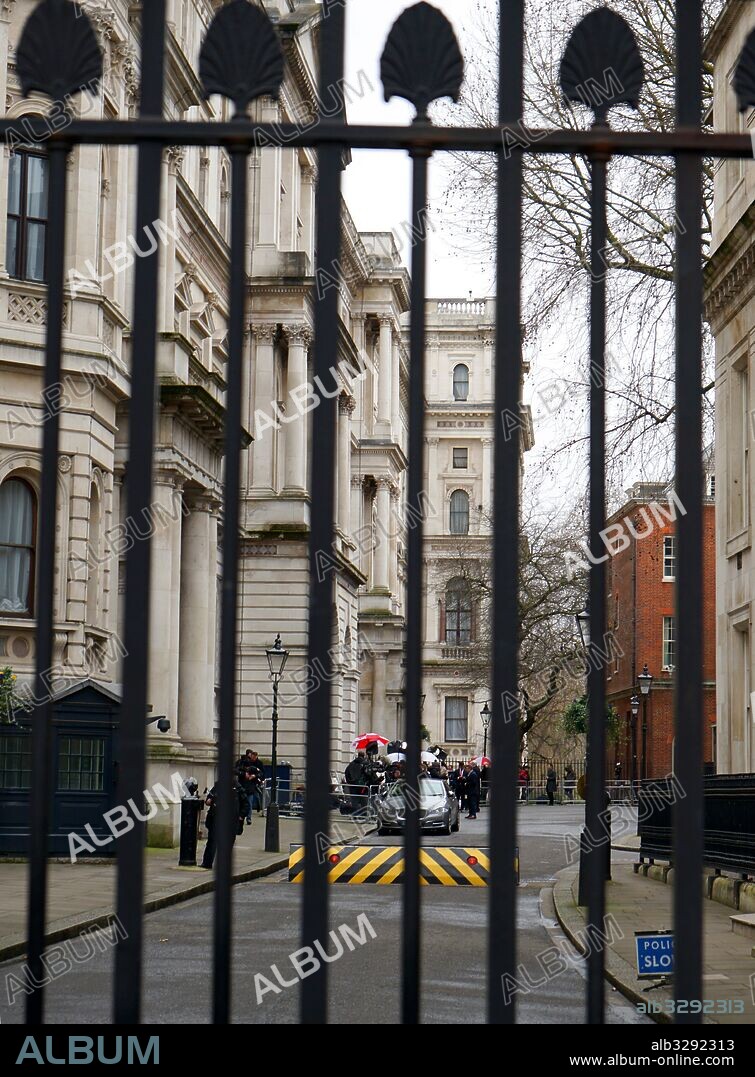Security gates guard the entrance to Downing Street, as press members gather, the day after the European Referendum Vote 23 June 2016.