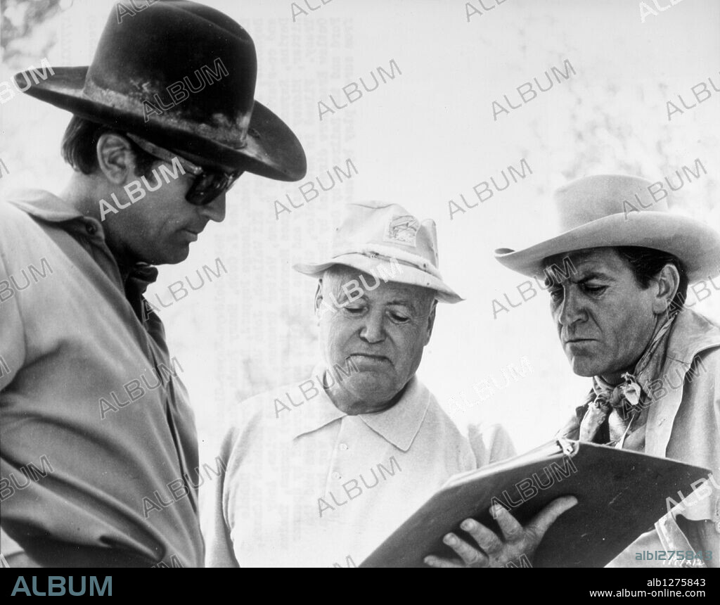 GREGORY PECK, HENRY HATHAWAY and ROBERT PRESTON in HOW THE WEST WAS WON, 1962, directed by GEORGE MARSHALL, HENRY HATHAWAY, JOHN FORD and RICHARD THORPE. Copyright M.G.M/CINERAMA.