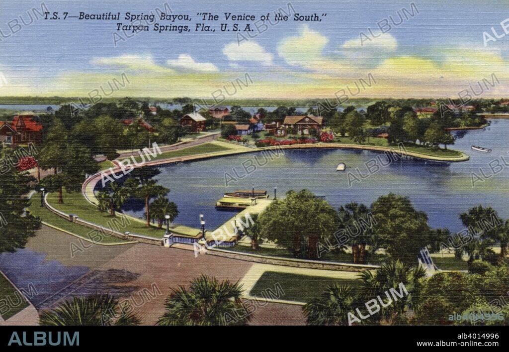 'Beautiful Spring Bayou, the Venice of the South, Tarpon Springs, Florida, USA', 1940. View showing the Spring Bayou and a beautifully landscaped neighbourhood with a dock in the foreground.