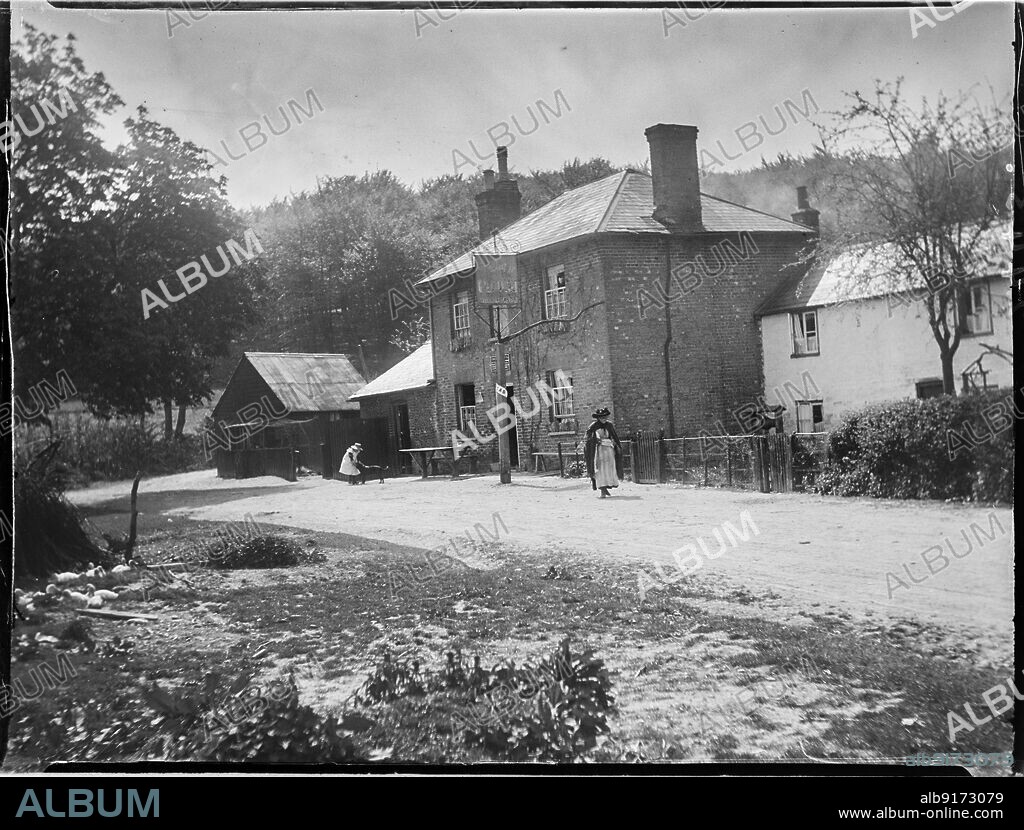 KATHERINE JEAN MACFEE. The Plough, Lower Cadsden, Princes Risborough, Wycombe, Buckinghamshire, 1910. A view of The Plough inn from the north, with a woman walking past the pub and a girl and dog outside the entrance.