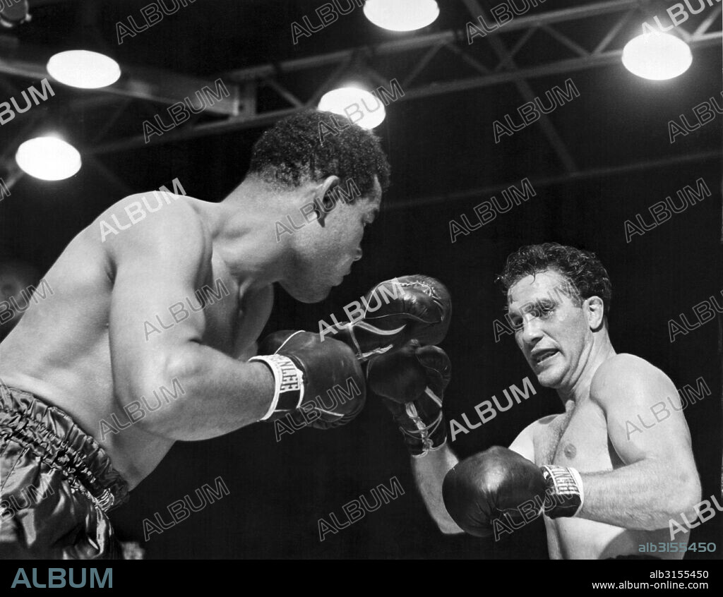 New York, New York:  June 19, 1946. Heavyweight champion Joe Louis is about to deliver the knockout punch to challenger Billy Conn in their championship bout at Yankee Stadium.