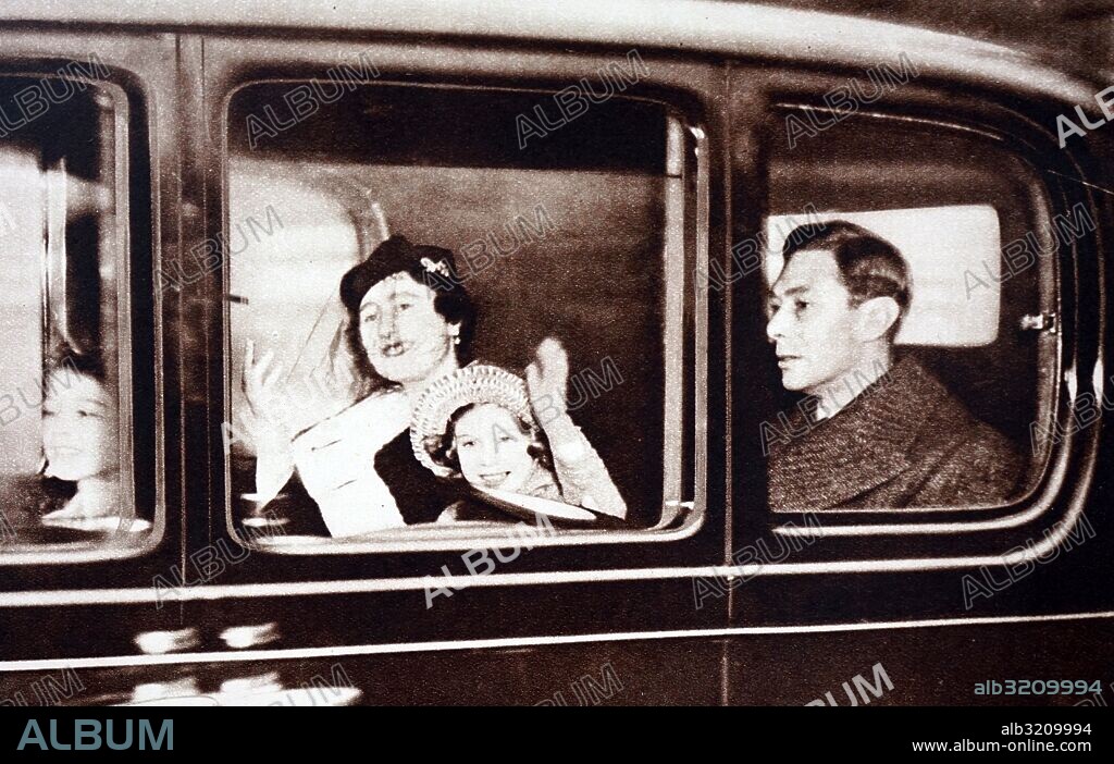 Photograph of King George VI (1895-1952), Queen Elizabeth, Queen Mother (1900-2002), Princess Elizabeth (1926-) and Princess Margaret (1930-2002) leaving for their Christmas break in Sandringham. Dated 20th Century.