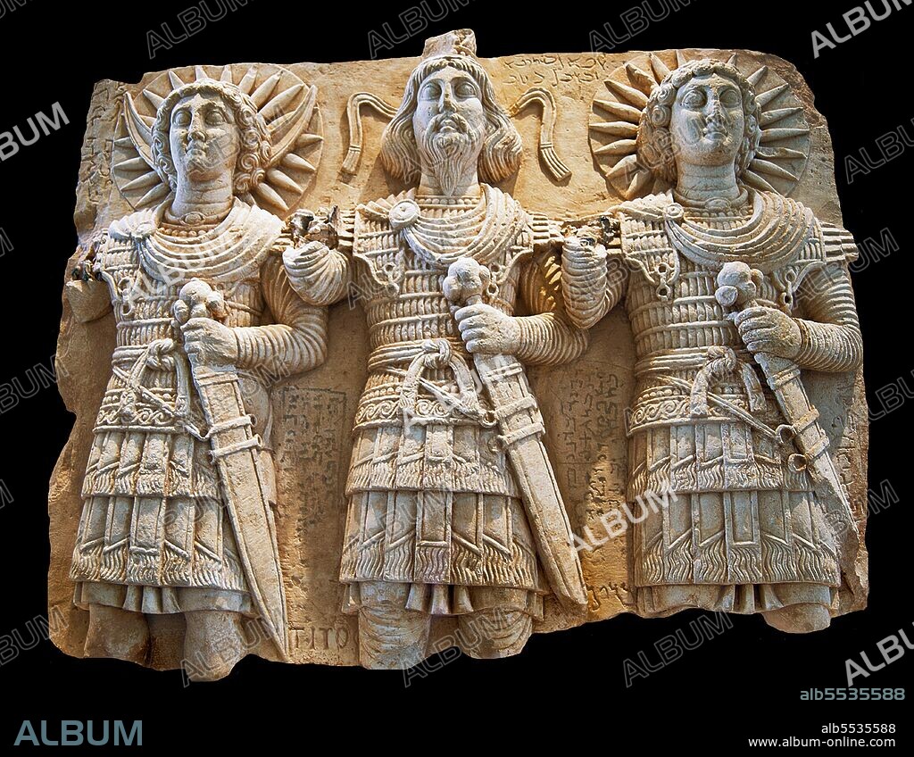 The Moon God Aglibol, the Supreme God Beelshamen, the Sun God Malakbel,  found at Bir Wereb, Wadi Miyah, near Palmyra. Palmyra was an ancient city in Syria. It was an important city in central Syria, located in an oasis 215 km northeast of Damascus and 180 km southwest of the Euphrates at Deir ez-Zor. It had long been a vital caravan city for travellers crossing the Syrian desert and was known as the Bride of the Desert. The earliest documented reference to the city by its Semitic name Tadmor, Tadmur or Tudmur (which means 'the town that repels' in Amorite and 'the indomitable town' in Aramaic) is recorded in Babylonian tablets found in Mari.