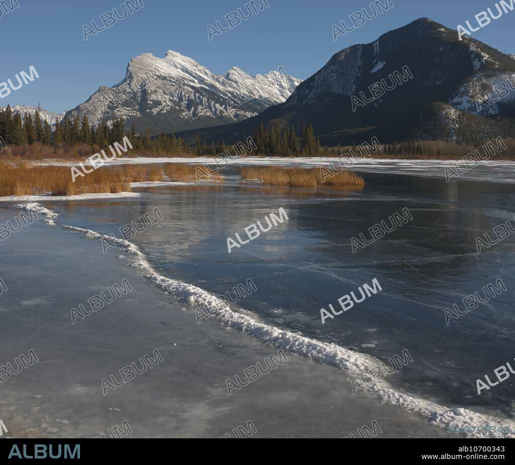Mt. Rundle and frozen Vermillion Lake; Banff National Park, Alberta, Canada.