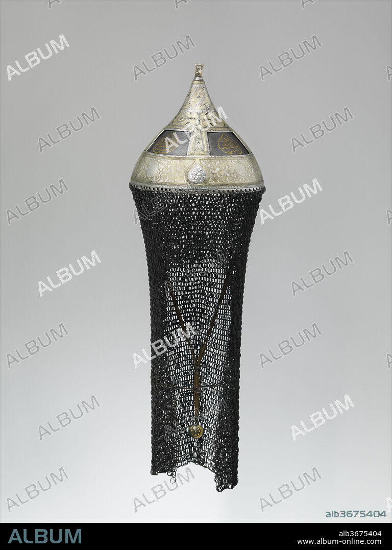 Helmet. Culture: Crimean or South Russian. Dimensions: H. including mail 22 1/4 in. (56.5 cm); H. excluding mail 5 1/4 in. (15.9 cm); Diam. 7 1/8 in. (18.1 cm); Wt. 3 lb. 13.4 oz. (1740.7 g). Date: dated A.H. 1223/A.D. 1808-9.
The Arabic inscriptions include the names of the maker and the owner, the latter apparently a descendant of the ruling house of the Crimean Tartars.