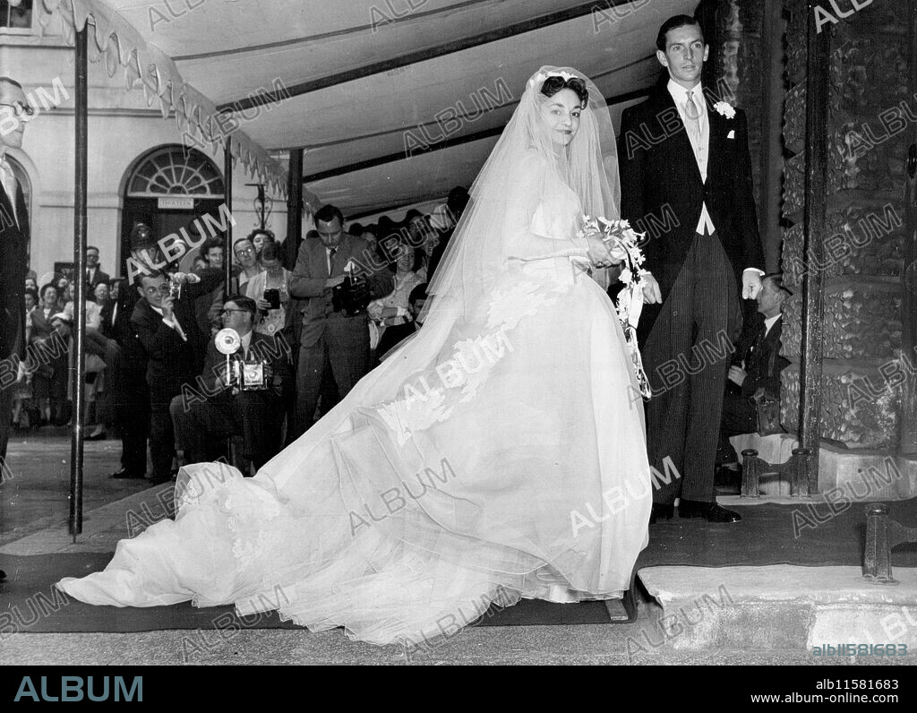 Today's Big Wedding Day Mr. Adrian Bailey and his bride, Lady Mary Baillie-Hamilton, daughter of the Earl and Countess of Haddington, pictured after their marriage this afternoon at St. James's, Spanish Place. They are seen arriving at Hutchinson House for the reception which was attended by the Queen and members of the Royal Family. Lady Mary was one of the Maids of Honour at the Queen's Coronation. July 21, 1954.