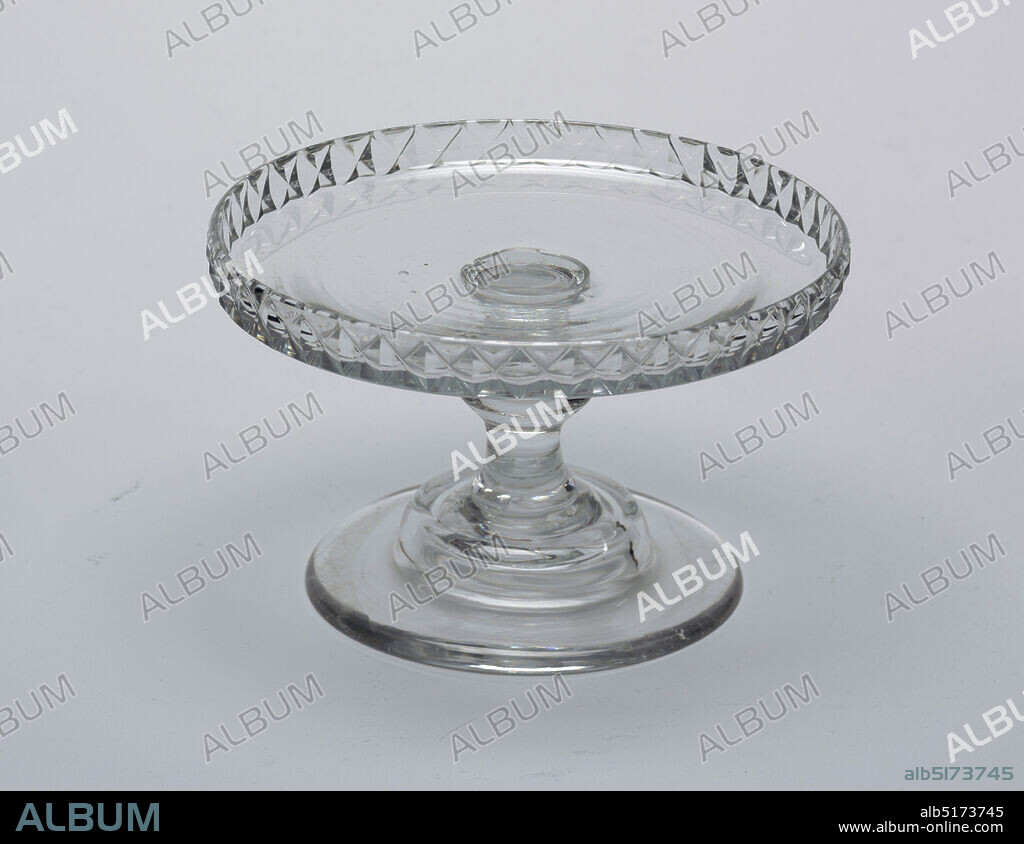 salver, glass, Flat circular tray with raised vertical rim cut with diamonds; tall stem with central knop; domed base with wide flat circular foot; ground pontil mark bottom., Ireland, ca. 1790, glasswares, Decorative Arts, salver.