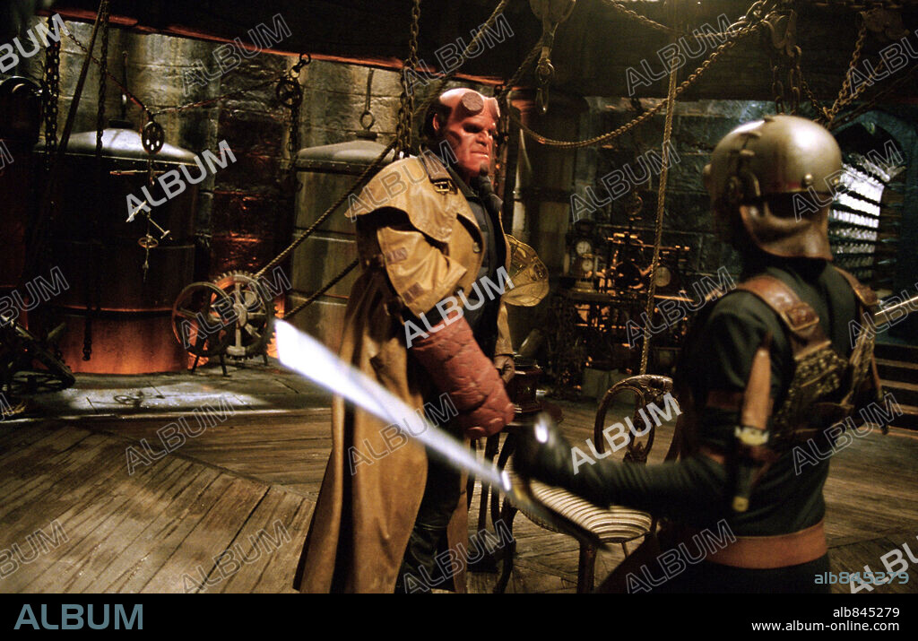 LADISLAV BERAN and RON PERLMAN in HELLBOY, 2004, directed by GUILLERMO DEL TORO. Copyright COLUMBIA PICTURES / ENDRENYI, EGON.