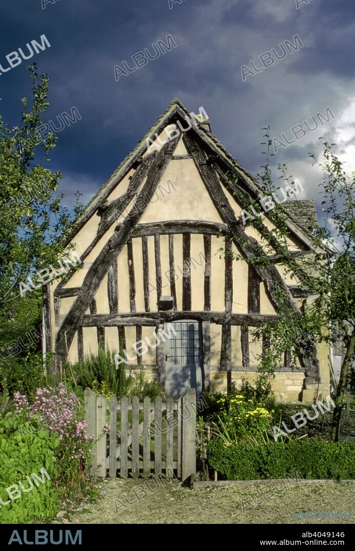 Medieval cruck framed cottage, Didbrook, Gloucestershire. A cruck is a curved timber used to support the roof of a building. The technique was particularly used in England.