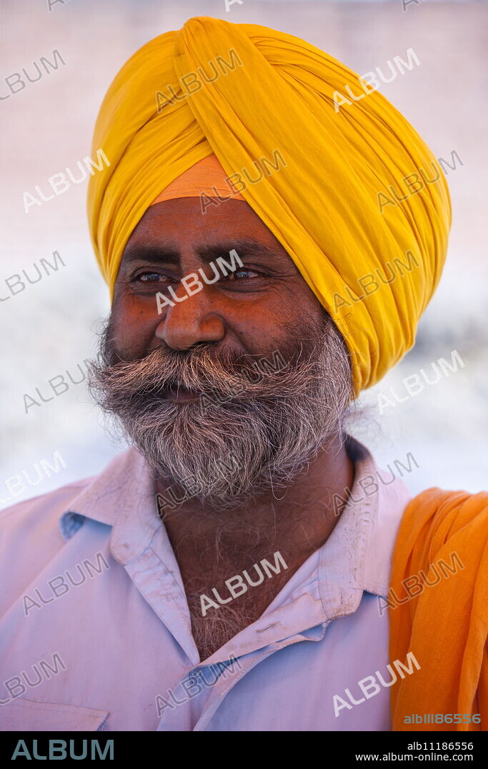 Sikh Indian man wearing traditional turban at Bharatpur, Northern India.