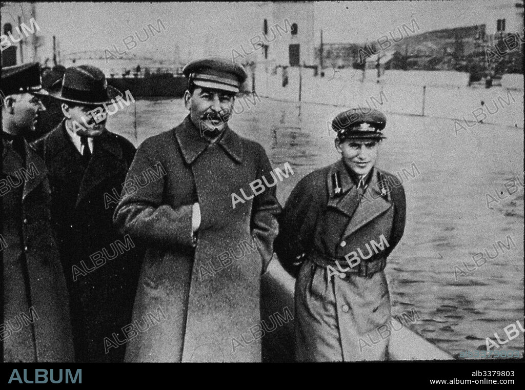 ANONYMOUS. Nikolai Yezhov with Stalin and Molotov at the Moscow-Volga Canal Embankment.