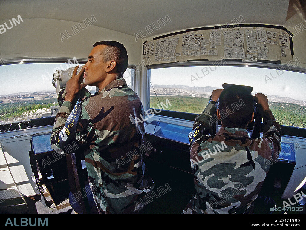 10/20/1998 - Soldiers keep an eye out for North Korean activity from Observation Post Oullette (OPO) on Oct. 20, 1998. OPO is the most strategic observation post in South Korea.