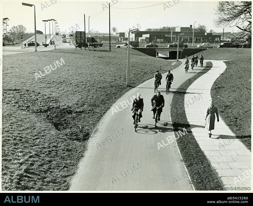 GL BLAKE. Six Hills Way, Stevenage, Hertfordshire, 1957-1965. Looking west towards the cycle and pedestrian paths beneath the carriageway of the Six Hills Roundabout at the junction of Six Hills Way and Lytton Way, with Six Hills Way crossing the main railway line in the left background. Stevenage was designated the first new town on 11th November 1946 and the first residents moved into their new homes in 1952. Formerly Crown Copyright (now expired).