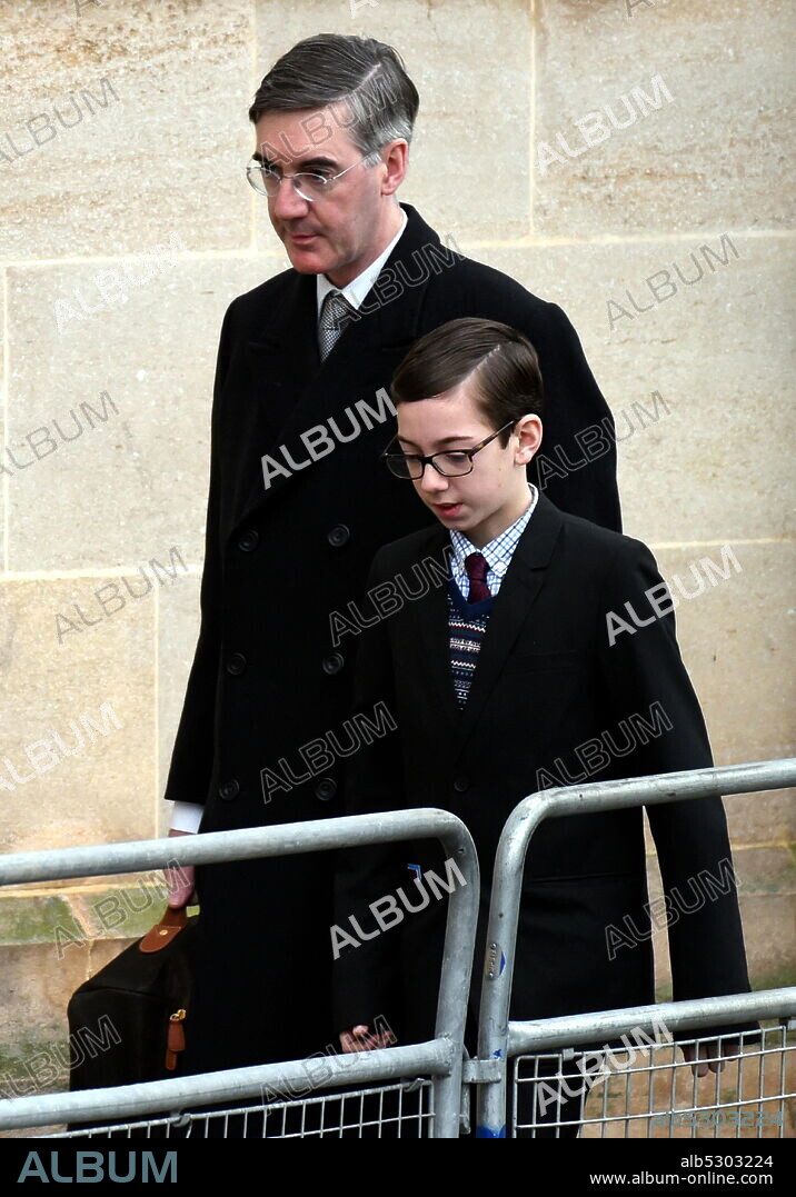 Photograph of Jacob Rees-Mogg with his, arriving for the state opening of Parliament. Jacob William Rees-Mogg (1969-) a British politician serving as Leader of the House of Commons and Lord President of the Council since 2019, and who has served as Member of Parliament for North East Somerset since 2010.