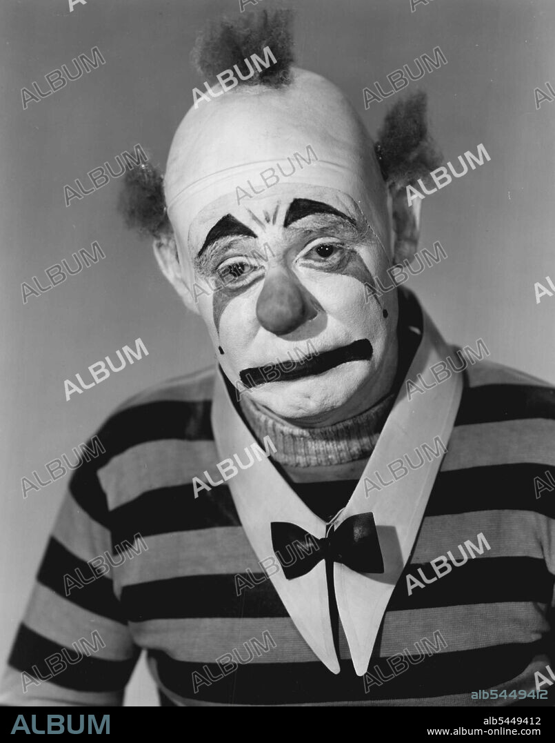 He's So Happy He'll Have A Good Cry! - Emmett Kelly, famous circus clown who has made millions laugh at his sad face, is about to make his movie debut, appearing in "The Pat Man," Universal-International's mystery thriller starring J. Scott Smart. Creator of the famous "Weary Willie" character clown of the circus rings, Kelly appeals in the film in a new face, however, the one shown herewith. His role calls for a Pagliacci-type clown, not a tramp - hence the change. Julie Lon don, Rock Hudson, Clinton Sundberg and Jayne Meadows play leading roles. April 13, 1951.
