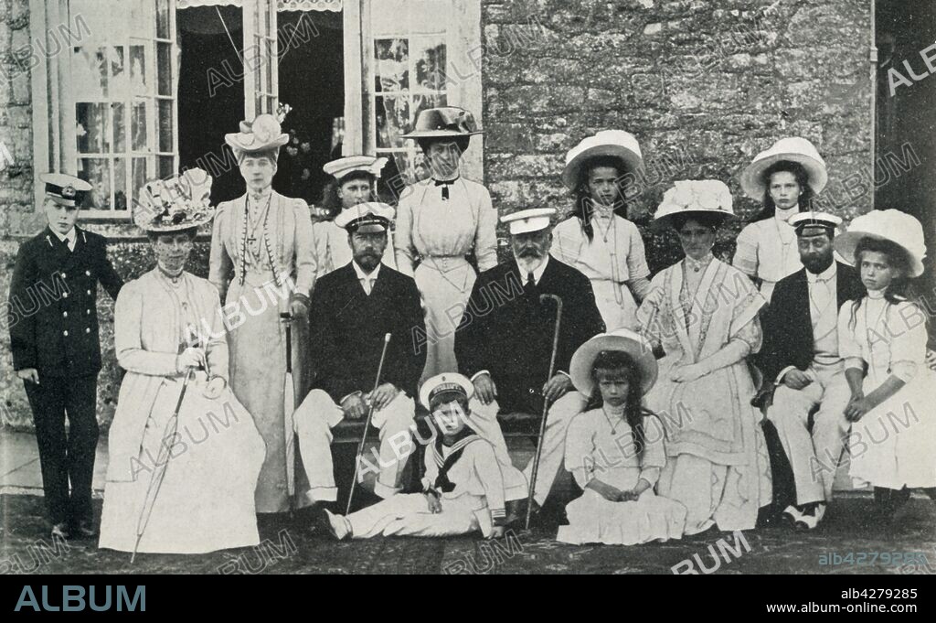ARTHUR WILLIAM DEBENHAM. The British and Russian royal families, 1909, (1951). 'An official photograph to mark the visit to this country in 1909 of the late Czar and Czarina of Russia, their four daughters and the young Czarevich. With them in the picture are King Edward VII and Queen Alexandra, King George V and Queen Mary, the Prince of Wales and the Princess Royal'. Portrait taken at Barton Manor, Isle of Wight on 4 August 1909, of Tsar Nicholas II and Tsarina Alexandra of Russia with their children Olga, Tatiana, Maria, Anastasia and Alexei; King Edward VII and Queen Alexandra with the future King George V (first cousin of the Tsar), Mary of Teck, the Prince of Wales (future King George VI) and Mary, Princess Royal. The Russian royal family were executed in 1918 by Bolshevik guards. From "The Queen Mother", by Marion Crawford ("Crawfie"), governess of Princess Margaret and Princess Elizabeth (the future Queen Elizabeth II). [George Newnes Limited, London, 1951].