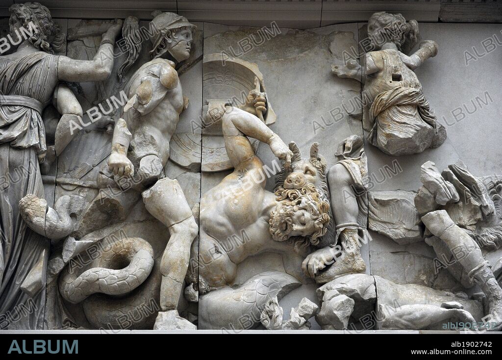 Pergamon Altar. Built by order of Eumenes II Soter. 164-156 BC. Marble and limestone. Gigantomachy. South frieze. The three-faceted goddess Hecate fighting with a torch, a sword and a lance against the giant Klytios (he doesn't appear). Next to her is Artemis fighting with a bow and arrow against a Giant who is perhaps Otos. Her hunting dog kills another Giant with a bite to the neck. Pergamon Museum. Berlin. Germany.