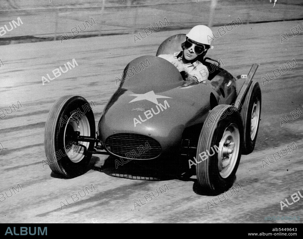 The Atom Racer -- Ronnie Moore, World speedway champion, 1954, speeds round the Wimbledon, London, track in the world's smallest racing car, prototype of a fleat expected to be racing in Britain next year.The car, styled atom-Car is powered by a 500 c.c. Speedway J.A.P. engine, In the first trial of the car the year, the machine over turned and Moore broke his collar-bone. Considered adjustment have since been made to the car. September 20, 1955. (Photo by Reuterphoto).