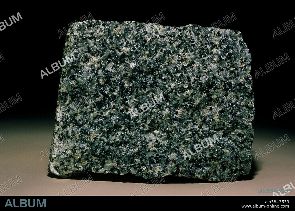 Gabbro is a coarse grained, equigranular igneous rock composed mainly of plagioclase feldspar (labradorite or bytownite) and orthoclase, a pyroxene such as augite, sometimes also nepheline and olivine, and a large percentage of hornblende (in hornblende gabbro). Rocks of this type are sometimes known as essexite. Gabbro forms as a result of the slow and undisturbed cooling of magma (molten rock) deep underground.
