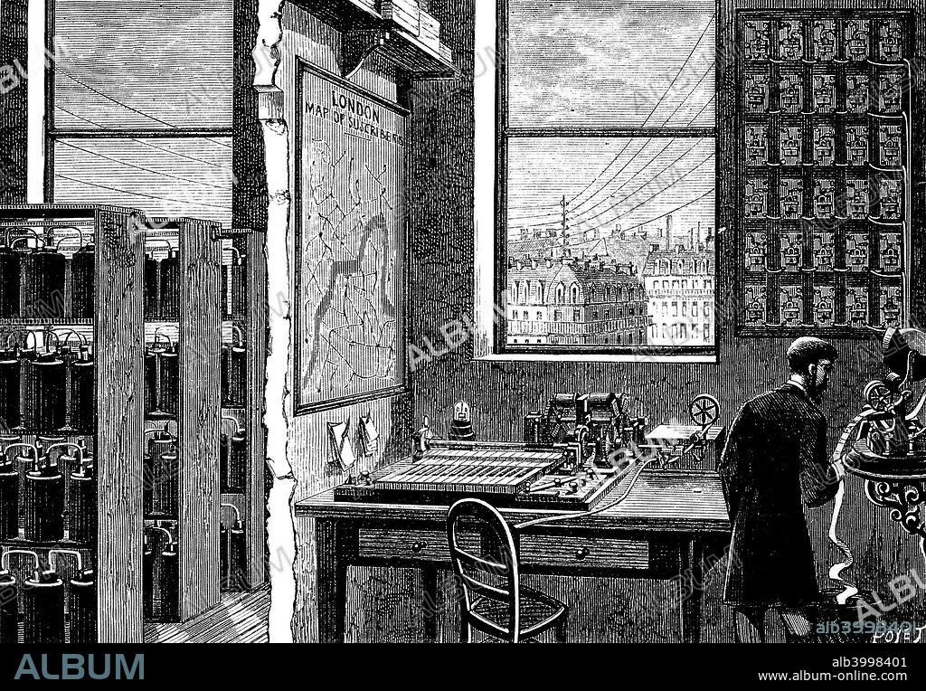 Main station of the Exchange Telegraph Company, London, 1882. An operator receives a message on a ticker-tape machine. A Morse transmitting instrument is connected directly to the Stock Exchange. Bichromate cells providing electricity can be seen on the left. From La Nature. (Paris, 1882).