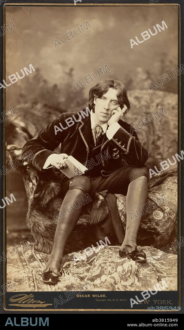 Oscar Fingal O'Flahertie Wills Wilde (October 16, 1854 - November 30, 1900) was an Irish writer and poet. As a spokesman for aestheticism, he tried his hand at various literary activities: he published a book of poems, lectured in the USA and Canada and then returned to London where he worked as a journalist. Known for his biting wit, flamboyant dress, and glittering conversation, Wilde had become one of the most well-known personalities of his day. At the height of his fame and success, Wilde had the Marquess of Queensberry, the father of his lover, Lord Alfred Douglas, prosecuted for libel. The trial unearthed evidence that caused Wilde to drop his charges and led to his own arrest, and trial for gross indecency, with other men. After two more trials he was convicted and imprisoned for two years' hard labor. He died destitute in Paris at the age of 46. Wilde appeared in Sarony's studio dressed in the attire he would wear at his lectures: a jacket, velvet vest, silk knee breeches and stockings, and slippers adorned with grosgrain bows. Napoleon Sarony, January 1882.